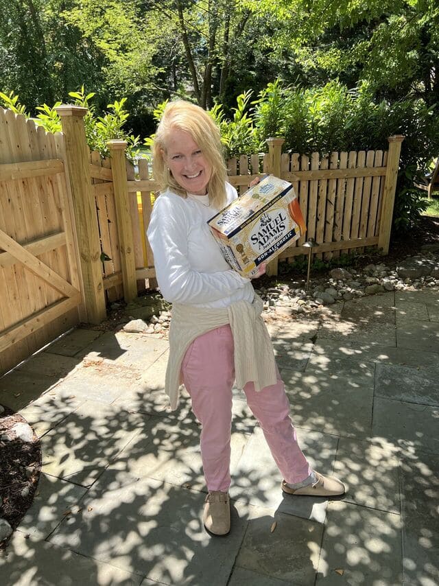 Amanda Haverstick holding Sam Adams NA IPA